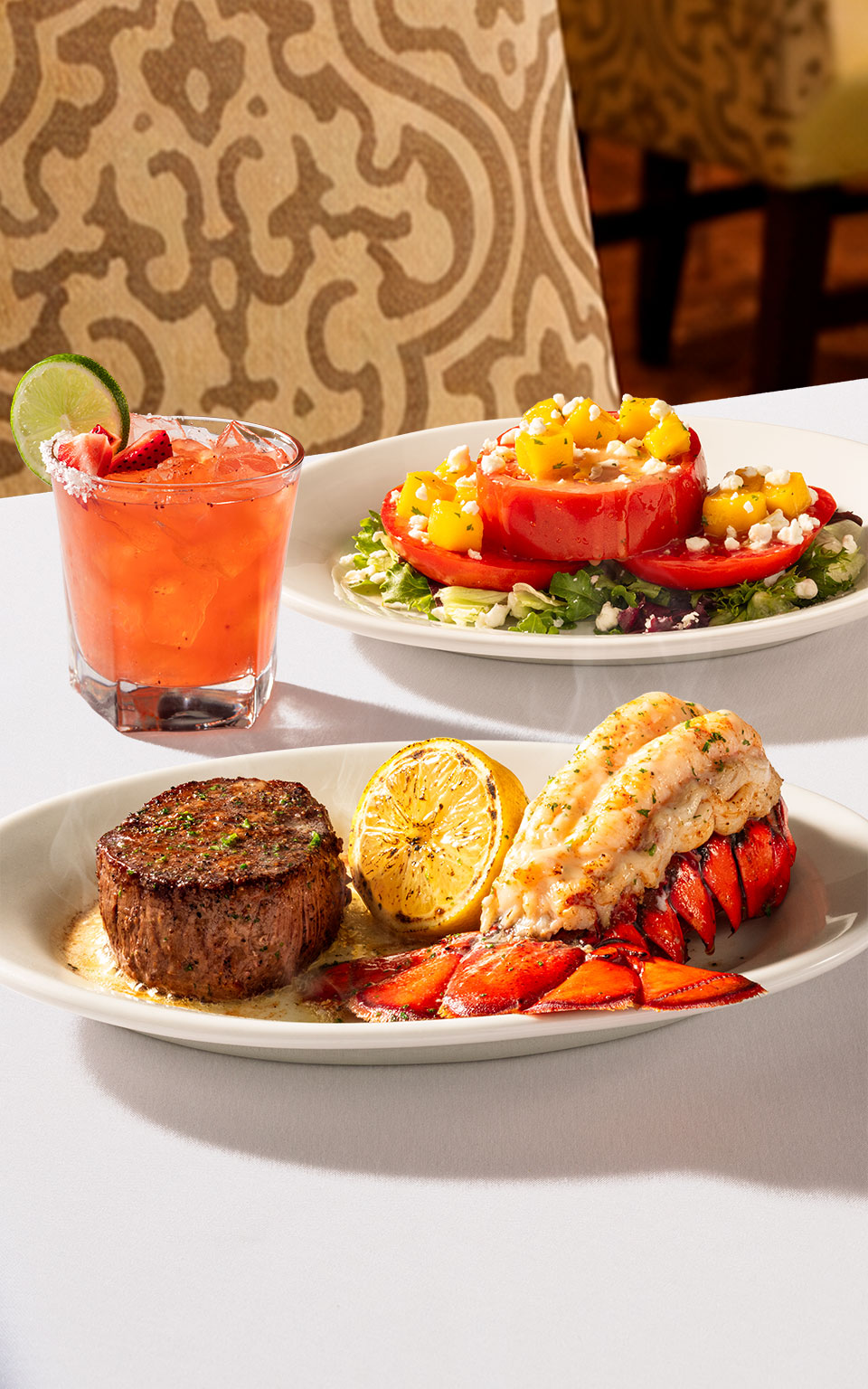 Ruth's Chris' Summer Selection: Spicy Strawberry Margarita, 8 oz Center-Cut Filet and Jumbo Lobster Tail, and a Summer Tomato Salad