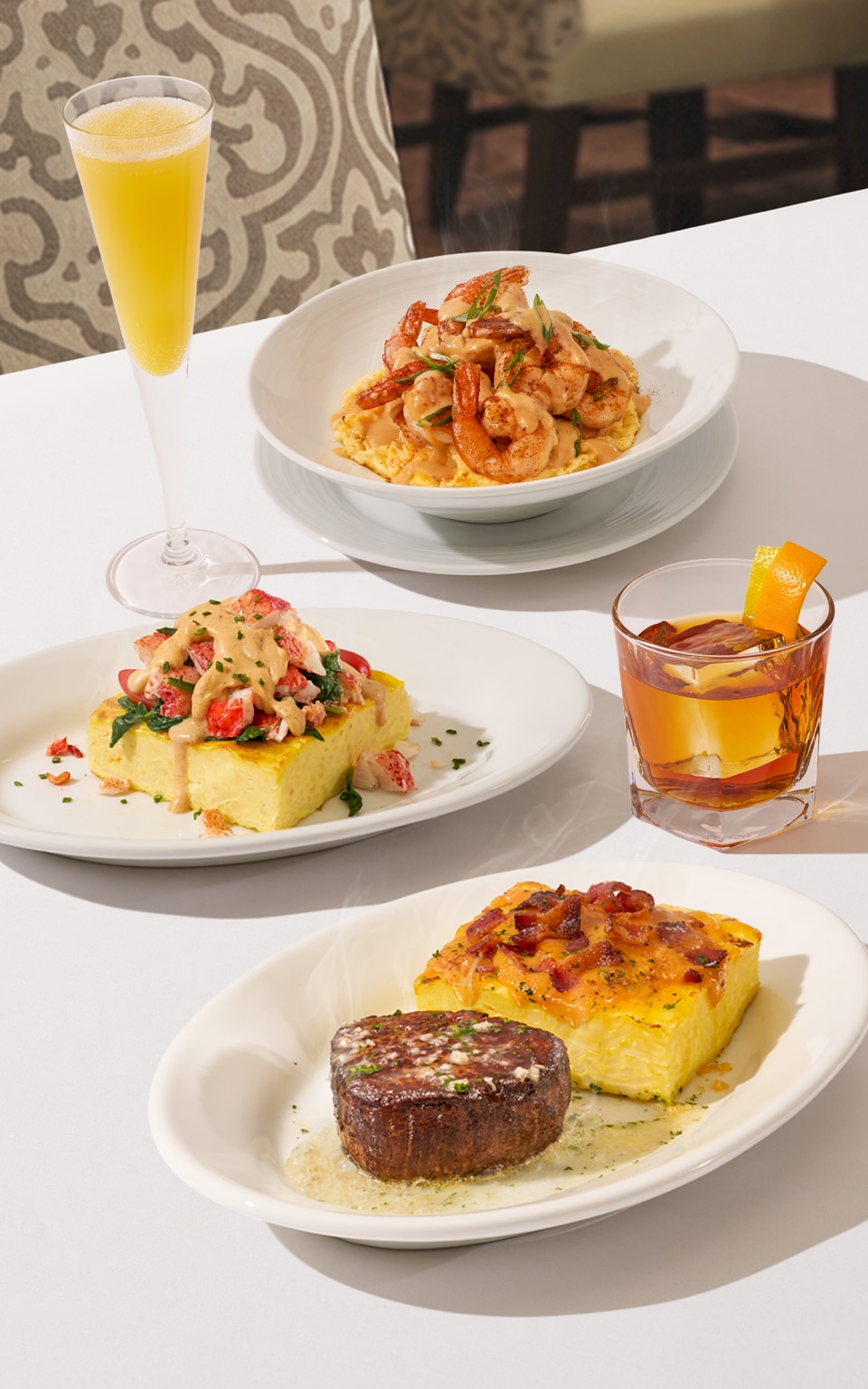 Father's Day Array: Shrimp and Grits, Lobster Frittata, and a 6 oz Center-Cut Filet with a Loaded Frittata. 
