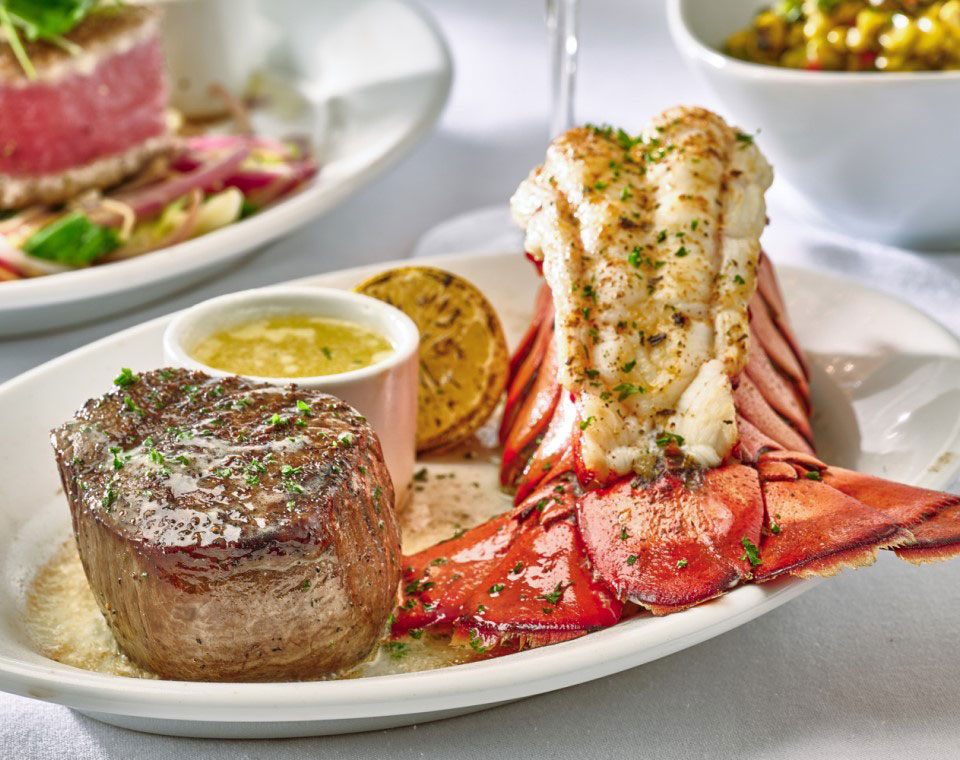 Ruth's Chris CHEF’S SUMMER SELECTIONS: 8 OZ CENTER-CUT FILET WITH JUMBO LOBSTER TAIL, a tender 8 oz center-cut filet paired with a succulent jumbo lobster tail
